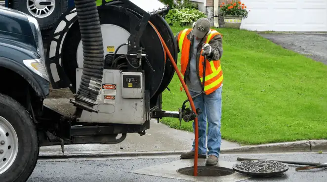 Technician using specialized drainage equipment for sewer line cleaning and foundation protection in Tallahassee, FL